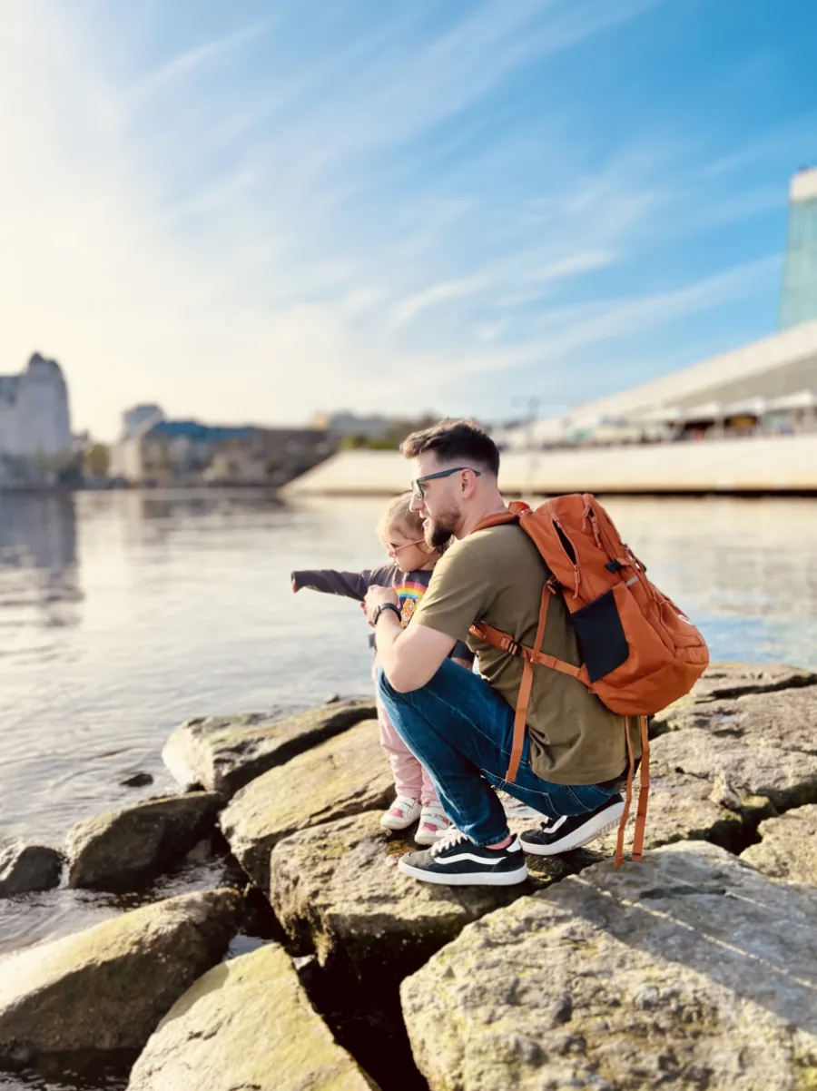 Pawel with his daughter by a river